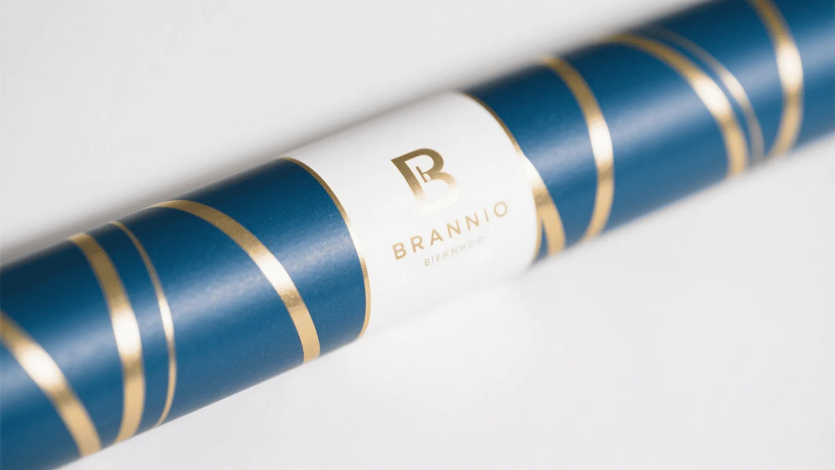 A close-up of beautifully designed custom wrapping paper featuring a brand's logo.