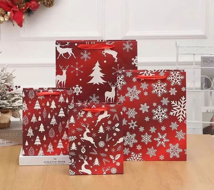 Holiday themed gift paper bags with custom seasonal prints