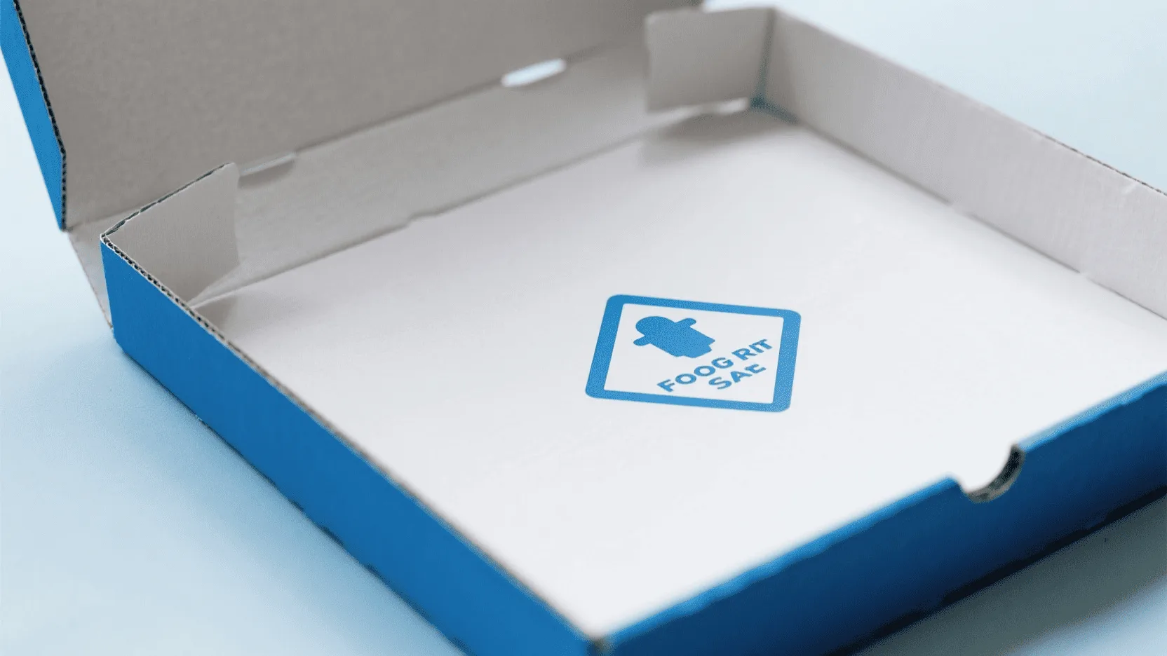 A close-up shot of a food-grade safety symbol printed discreetly on the inside of a clean pizza box.