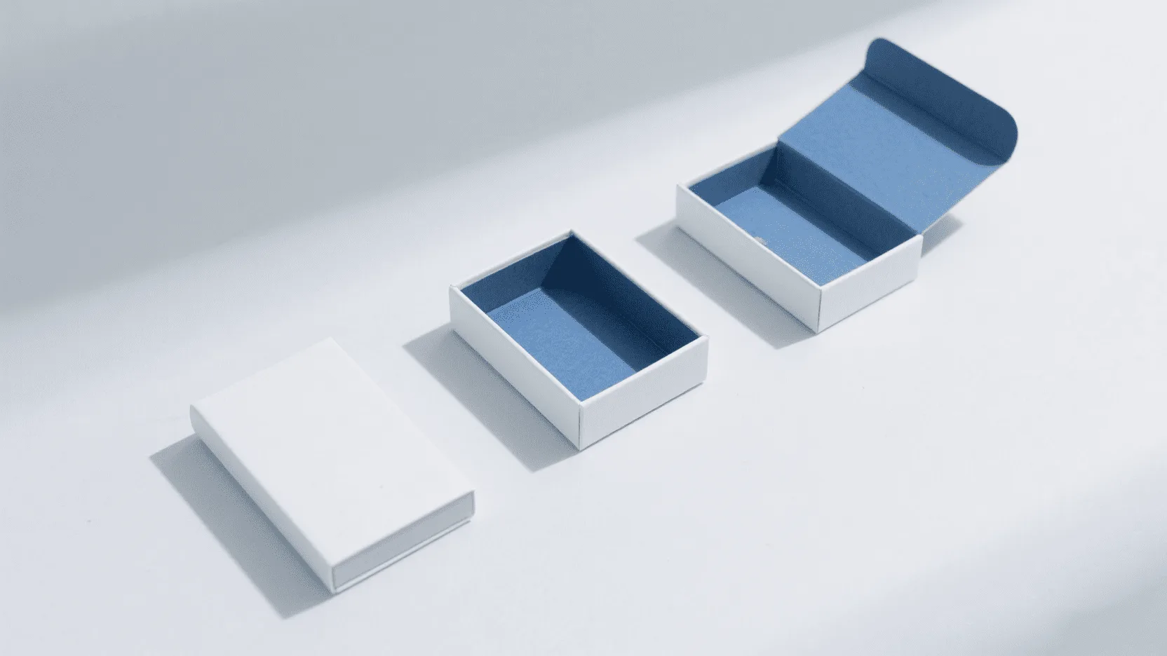 An image showing the three stages of a magnetic fold box: flat, partially assembled, and fully constructed.