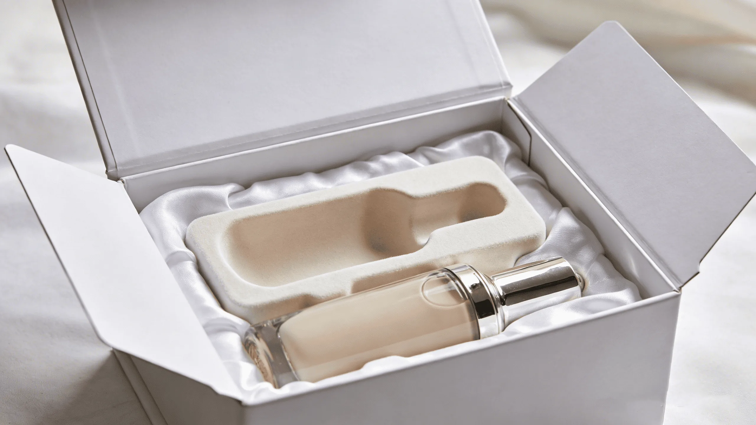 Close-up shot of the clean, sharp edges and seamless hinge of a high-quality rigid flip-top box.