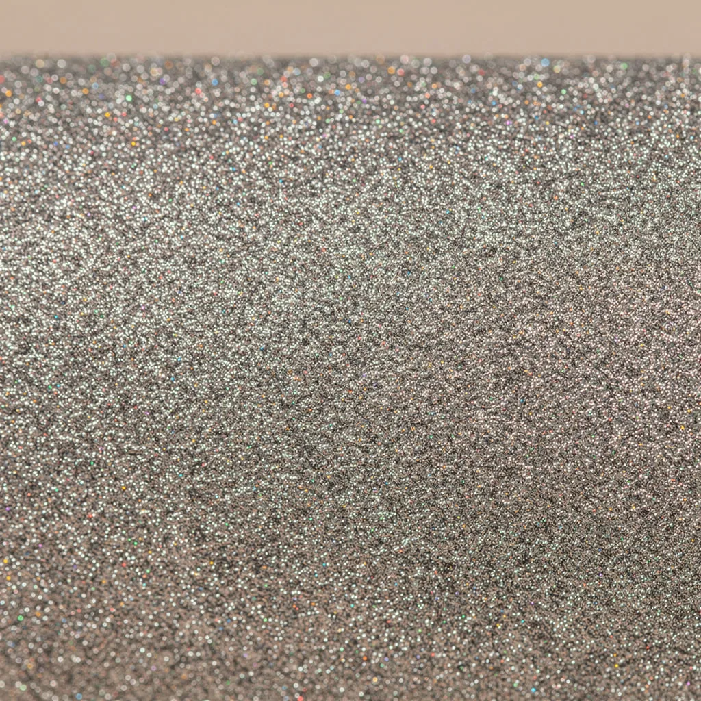 alt: A close-up view showing the textured, non-shedding surface of a high-quality glitter paper