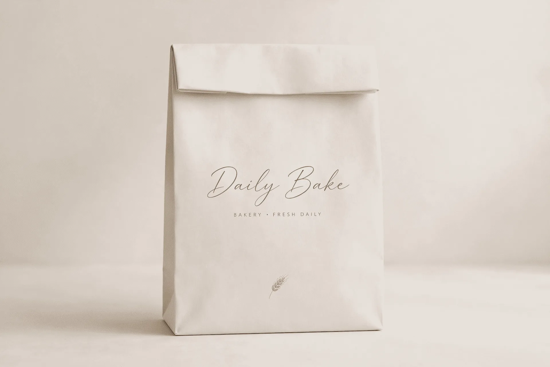 alt: A minimalist bakery bag in a pastel color with a simple, elegant script logo