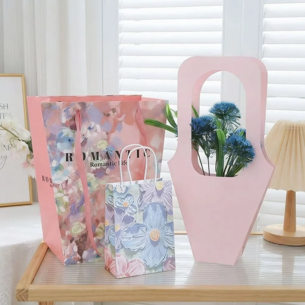A side-by-side diagram showing a tall, gusseted bag for a bouquet and a wide, square-bottom tote for a gift box.