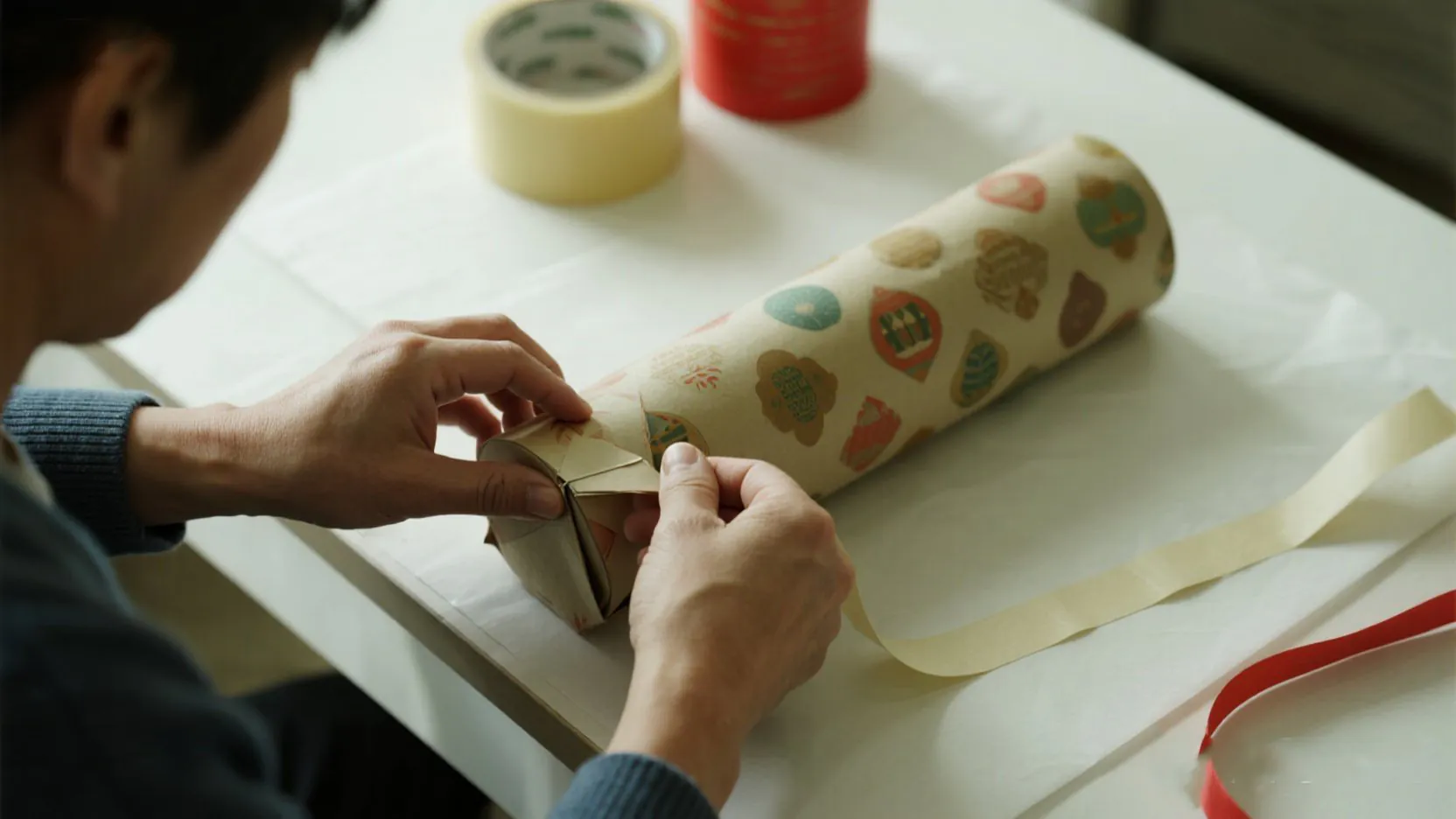 Using double-sided tape to create an invisible seam on a gift